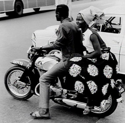 A man and a lady on a motorcycle in Lagos Nigeria (1969)