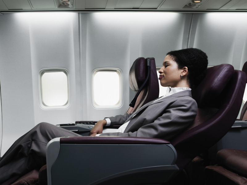 Business woman sleeping on a plane